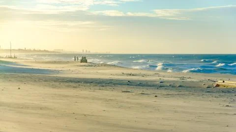 Buggy on the beach at the sunset Stock Photos
