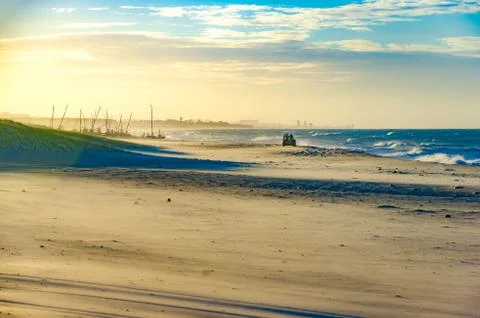 Buggy on the beach at the sunset Stock Photos