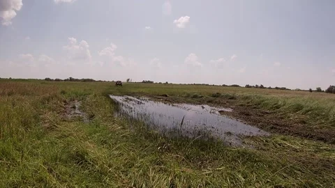 Buggy Can-Am driving at high speed through a puddle Stock Footage 159353273