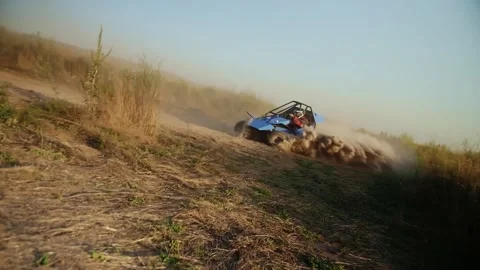 Buggy car driving fast in cross country road. Fast rally auto is going with big Stock Footage 208945113