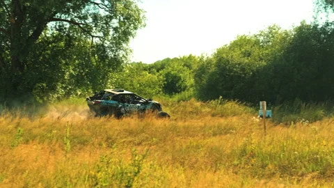 Buggy car going fast in cross country road. Fast rally auto is driving Stock Footage 136156022