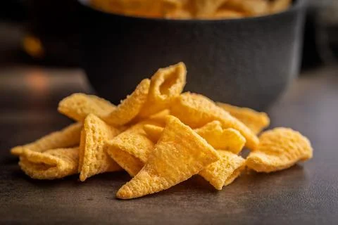 Bugles snack. Cone corn chips on kitchen table. Stock Photos