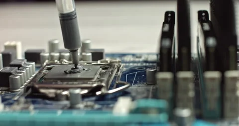 Build computer concept. Close-up shot of applying thermal paste on cpu. 4k Stock Footage 144958764