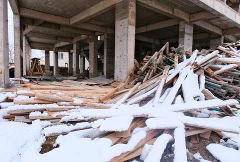 Build. Construction materials on which snow falls. Stock Photos