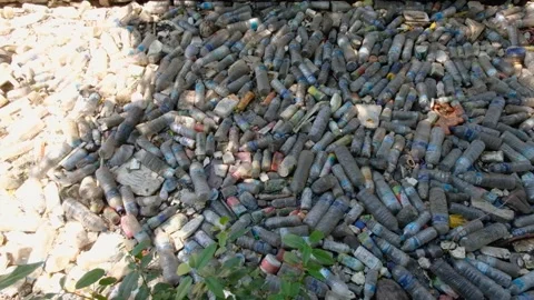 Build up plastic water bottles and plastic trash in river stopped entering Video stock 337963950