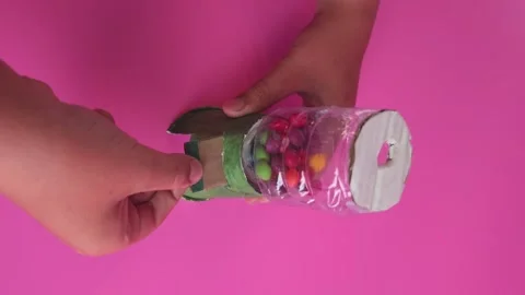 Build a simple candy dispenser with your child for fun and creativity Stock Footage 338406301