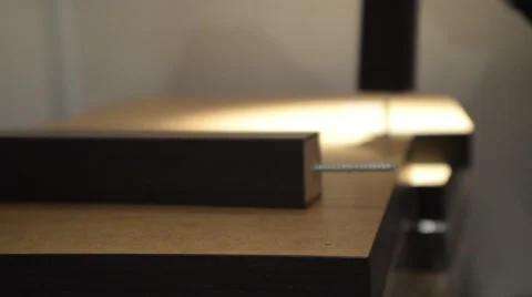Build the table. Screwing the legs Stock Footage 62463036