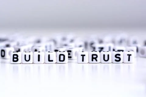 Build trust process concept with tiled letters on white background Stock-Fotos