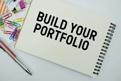Build Your Portfolio text message written on notepad with stationery flat l.. Stock Photos