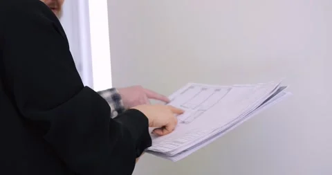 Builder and client engage in detailed planning for home interior. Strategic Stock Footage 275266677