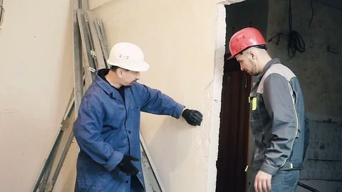 Builder and Manager checking colleagues work Stock Footage 99781205