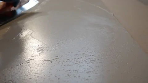 Builder applies the plaster with a trowel and smoothes the surface Stock Footage 157429007