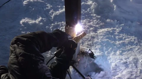 The builder applies welding Stock Footage 163567918