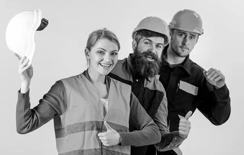 Builder, architect, engineer as friendly team. Woman and men Stock Photos