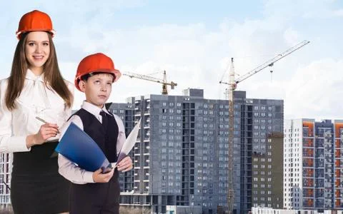 Builder boy in the orange helmet Stock Photos