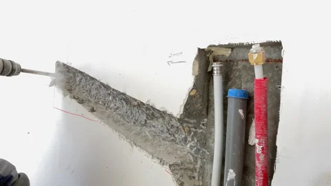 The builder breaks concrete at a construction site. Powerful hammer drill Stock-Footage 155358557