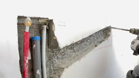 The builder breaks concrete at a construction site. Powerful hammer drill Stock-Footage 155358727
