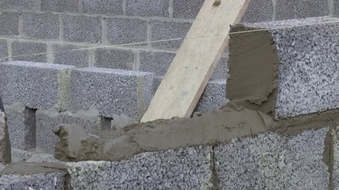 Builder building blocks for a house Stock Footage 78060890