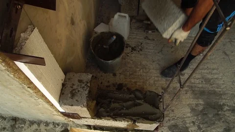 The Builder Builds A Concrete Wall With A Cement Block. Vídeos de archivo 93587343