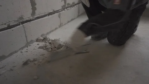 Builder collects construction waste Stock Footage 101663388