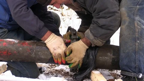 Builder connect pipes concrete pump fill retaining wall suburban land plot Stock Footage 83498890