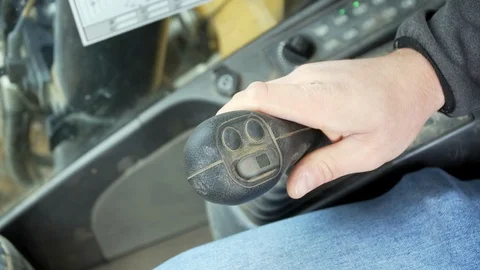 The Builder controls the bucket of the excavator Stock Footage 121724534