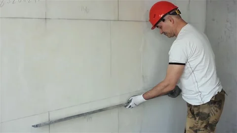 Builder controls quality of construction of partition Stock Footage 107498318