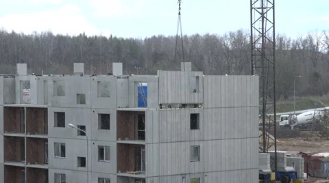 Builder with crane attach last block house wall frame part. 4K Stock Footage 56959111