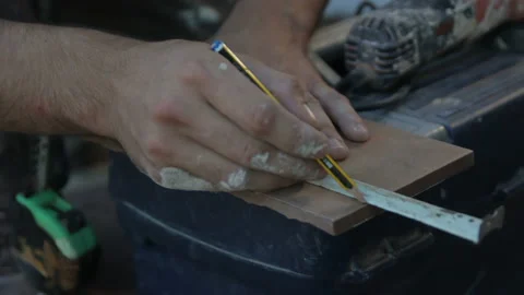 Builder Creating Cutting Mark with Pencil 1 Stock Footage 145926219