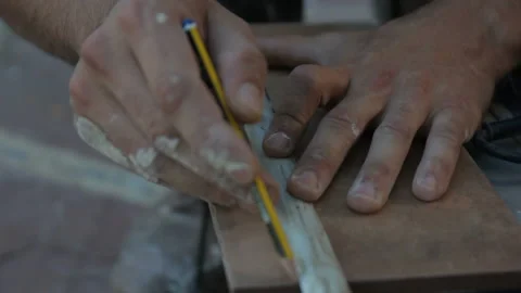Builder Creating Cutting Mark with Pencil 2 Stock Footage 145935448