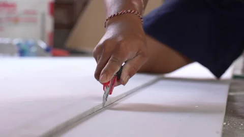 The builder cut by knife in construction. Stock Footage 299964860