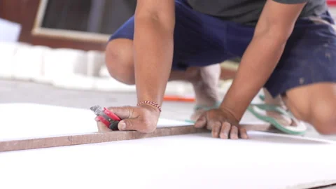 The builder cut by knife in construction. Stock Footage 299966151
