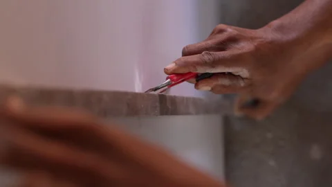 The builder cut by knife in construction. Stock Footage 299968740