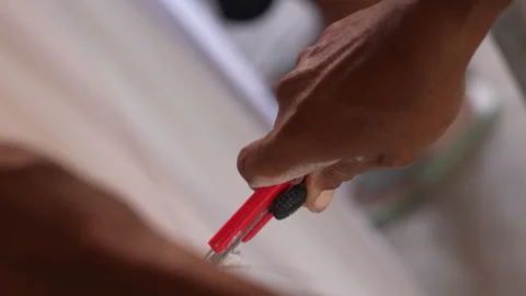 The builder cut by knife in construction. Stock Footage 299969149