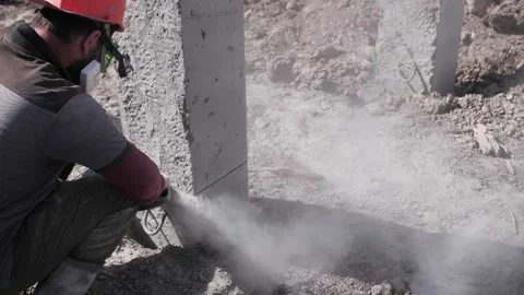 A builder cuts concrete with a grinder Stock Footage 194844695