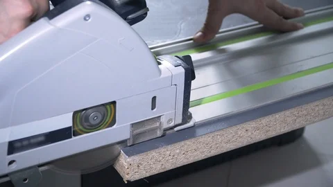 The Builder cuts an electric saw Видео 103949693