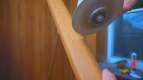 The builder cuts the plinth with an electric tool Stock Footage 93741927