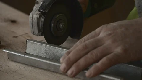 Builder cutting with metal grinder Stock Footage 119376919