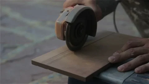 Builder cutting tile with radial arm saw Stock Footage 145196279