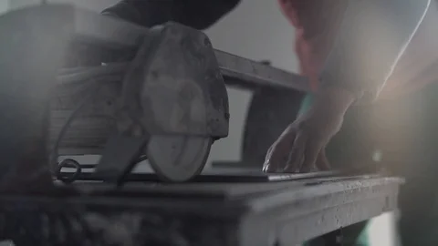 The builder is cutting tiles Stock Footage 129108241