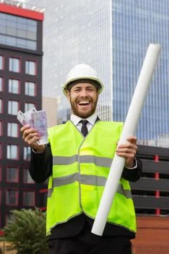 Builder is dancing project completed fun happy money  emotions Fotos de archivo