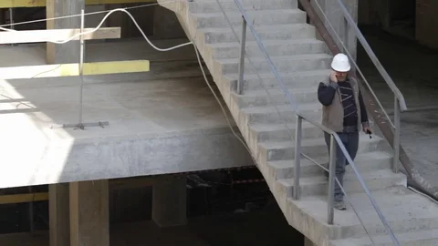 The builder descends the stairs Video stock 75228109
