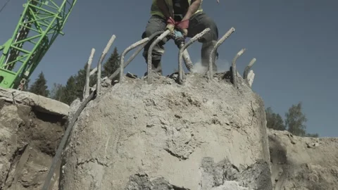 Builder destroys foundation with impact hammer Stock Footage 285143550