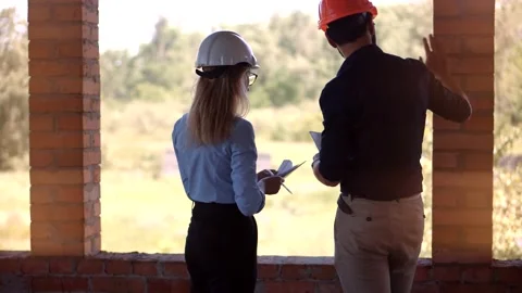 Builder Developer Architect Blueprint.Building Project Manager Construction Site Stock Footage 134450272