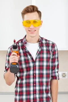 Builder with a dril Stock Photos