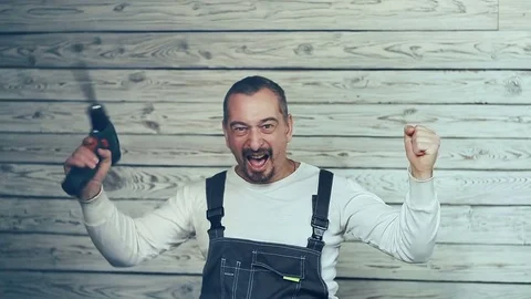 Builder with a drill rejoices earned money Видео 83343559
