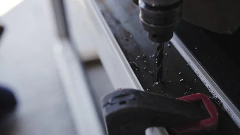 Builder drills with drill, drill bit close-up Stock Footage 218232740