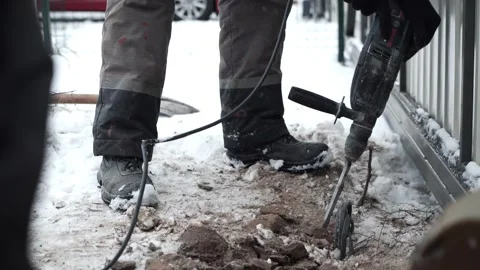 Builder Drills a hole in the wall with a Hammer Drill Stock Footage 263294842