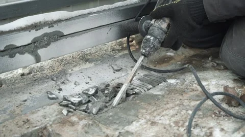 Builder Drills a hole in the wall with a Hammer Drill Stock Footage 263294895