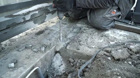 Builder Drills a hole in the wall with a Hammer Drill Stock Footage 263294906